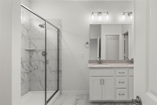 bathroom featuring vanity and a shower with shower door