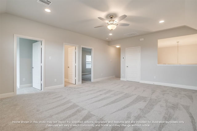 unfurnished room featuring light carpet and ceiling fan