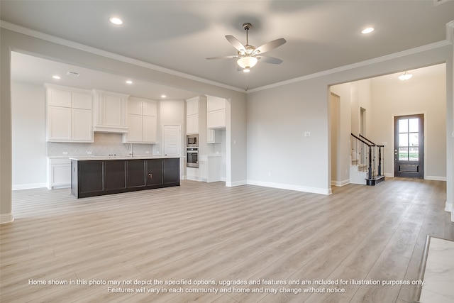 unfurnished living room featuring ornamental molding, sink, ceiling fan, and light hardwood / wood-style flooring