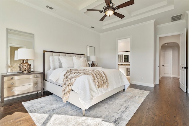 bedroom with a raised ceiling, crown molding, dark hardwood / wood-style floors, and ceiling fan