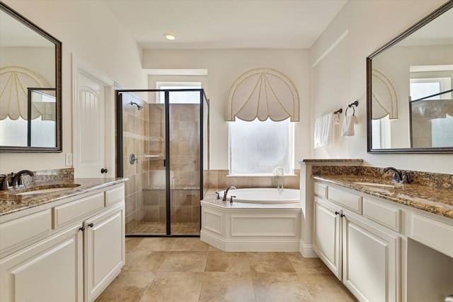 bathroom featuring vanity, independent shower and bath, and tile patterned flooring