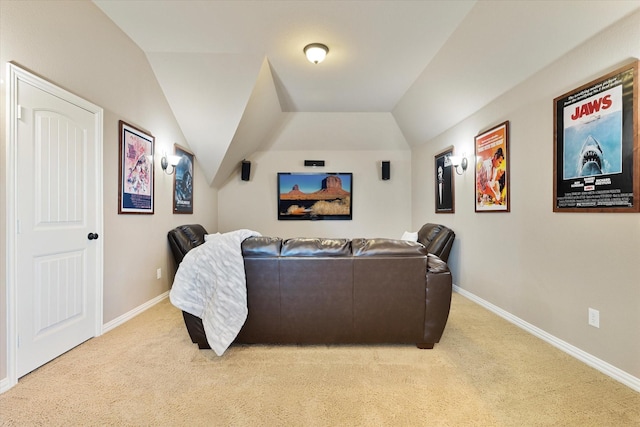 home theater with light colored carpet and lofted ceiling