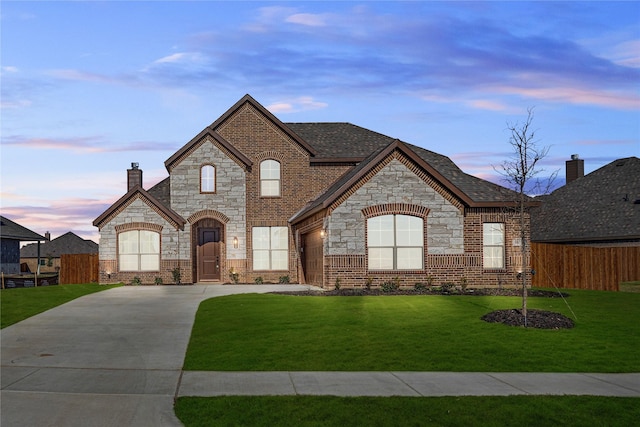 french country style house featuring a lawn