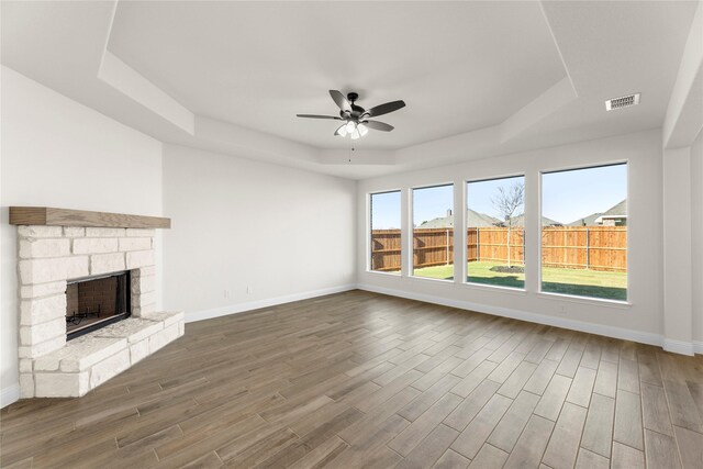 unfurnished dining area featuring plenty of natural light, wood-type flooring, and an inviting chandelier