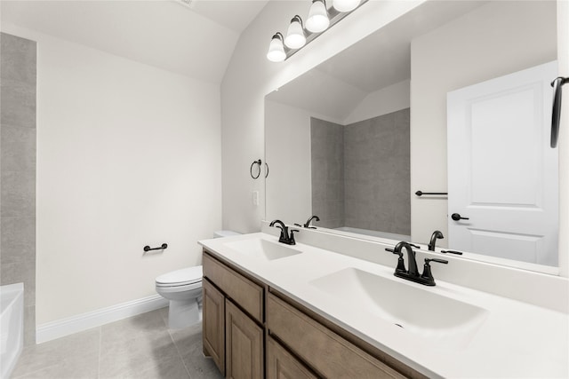 bathroom featuring vanity, lofted ceiling, a washtub, and toilet