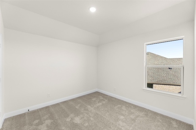 unfurnished room with light colored carpet