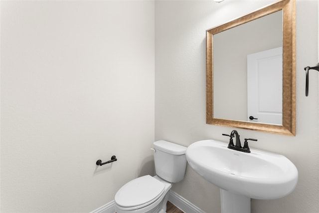 bathroom featuring sink and toilet