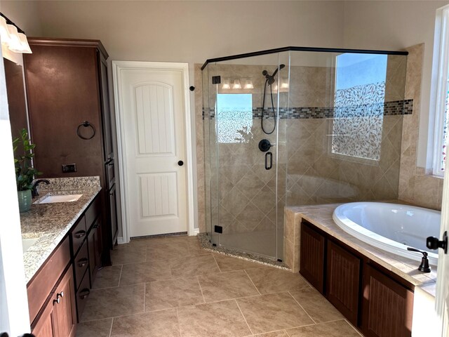 bathroom featuring independent shower and bath and vanity