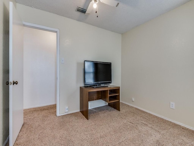 bedroom featuring baseboards, carpet, visible vents, and a textured ceiling