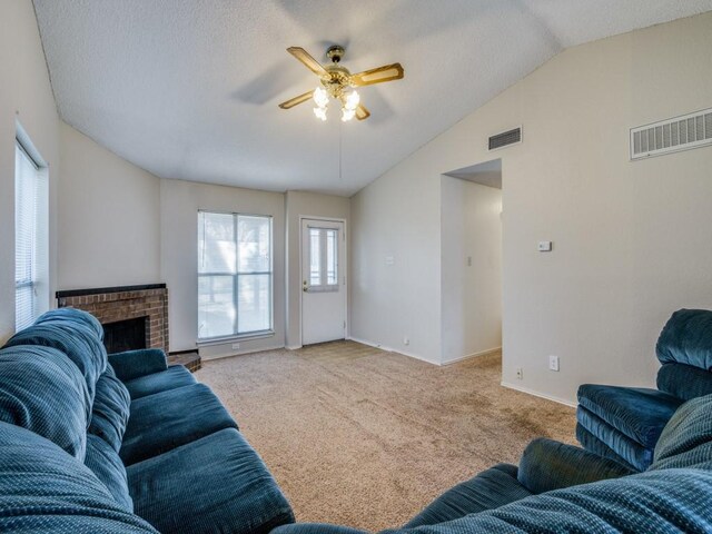 carpeted living room featuring vaulted ceiling and ceiling fan