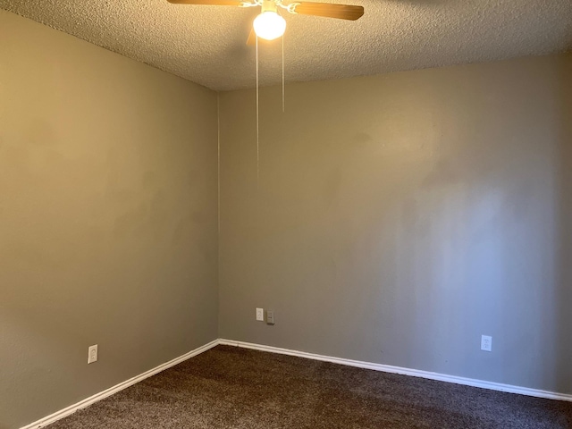 unfurnished room with ceiling fan, carpet, and a textured ceiling