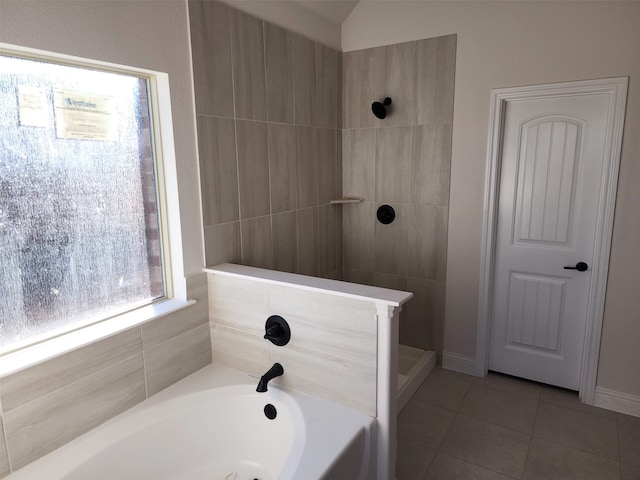 bathroom featuring plus walk in shower and tile patterned floors