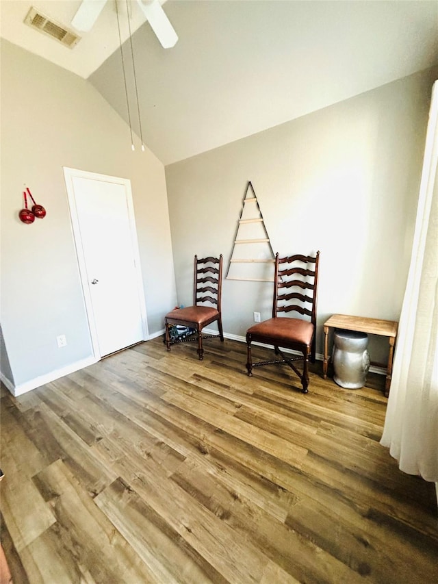 sitting room with wood-type flooring, ceiling fan, and lofted ceiling