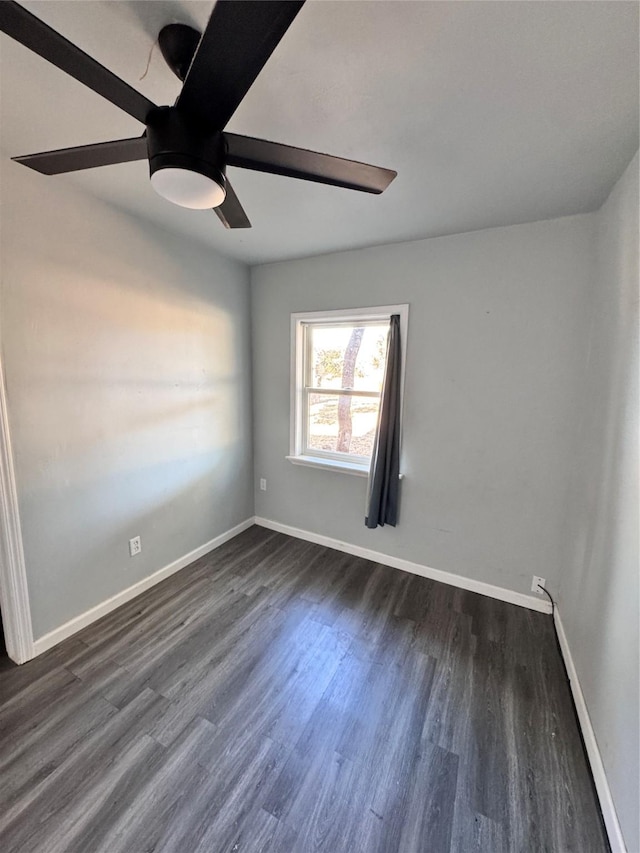 unfurnished room featuring dark hardwood / wood-style floors and ceiling fan