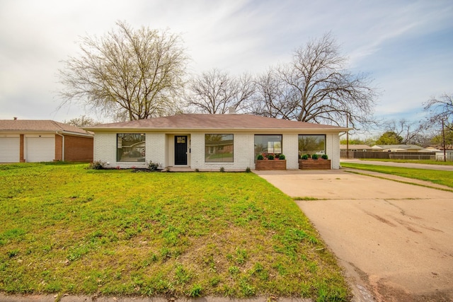 ranch-style home with a front lawn