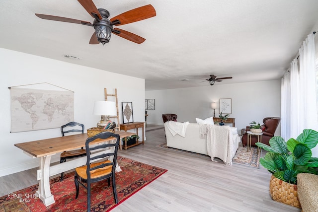 living room with light hardwood / wood-style floors