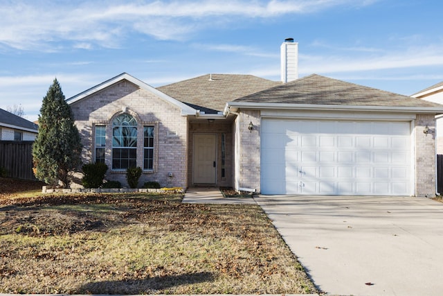 ranch-style home featuring a garage