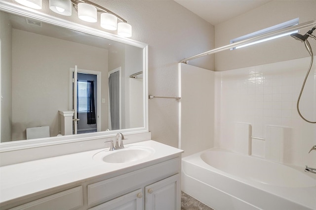 bathroom with vanity and shower / washtub combination