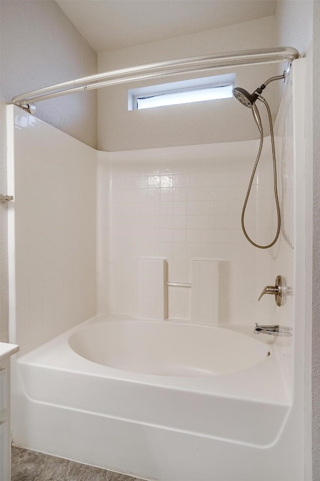 bathroom with bathing tub / shower combination