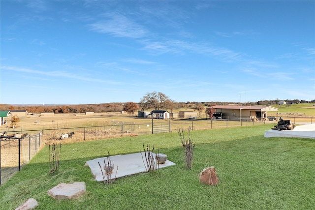 view of yard with a rural view