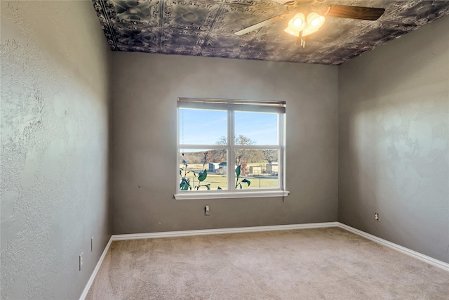 carpeted empty room with ceiling fan