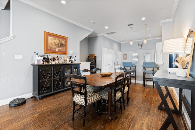 dining room featuring a notable chandelier, dark hardwood / wood-style flooring, crown molding, and indoor bar