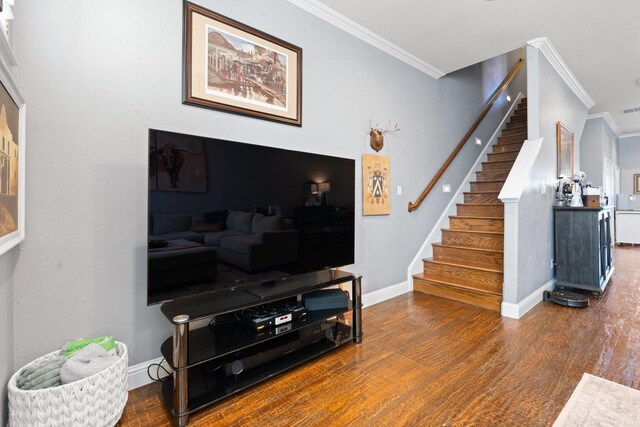 living room featuring dark hardwood / wood-style flooring and ornamental molding