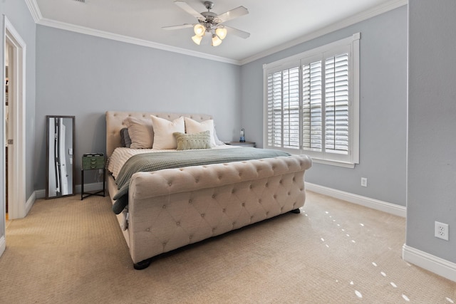 bedroom with ceiling fan, light carpet, and ornamental molding