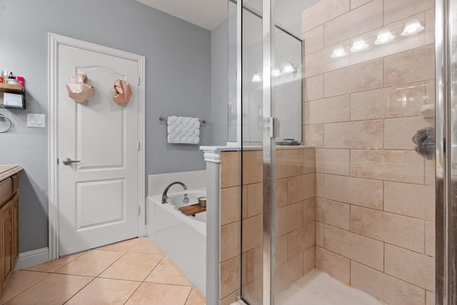 bathroom with tile patterned floors, separate shower and tub, and vanity