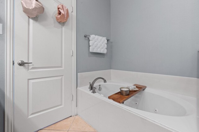 bathroom featuring a bath and tile patterned floors