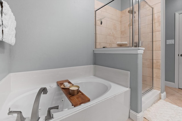 bathroom featuring plus walk in shower and tile patterned floors