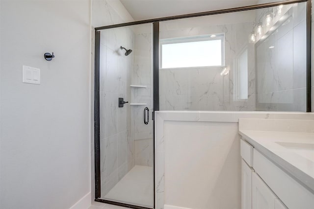 bathroom with vanity and walk in shower