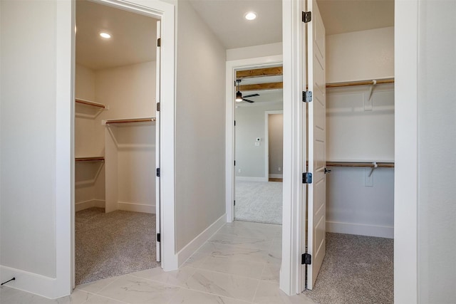 bathroom featuring beamed ceiling and ceiling fan