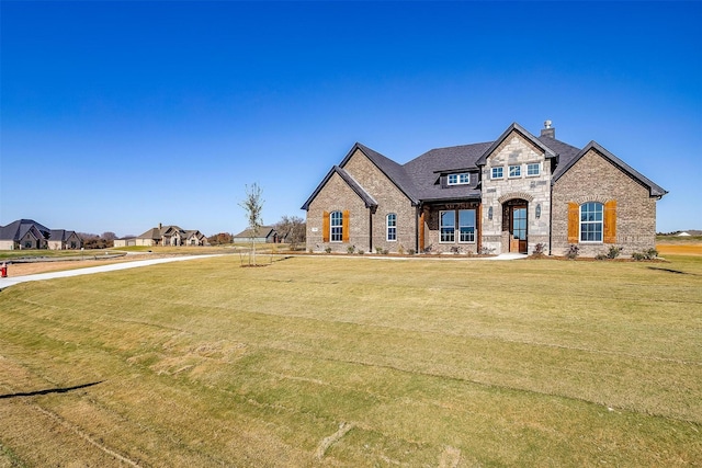 view of front of house with a front lawn