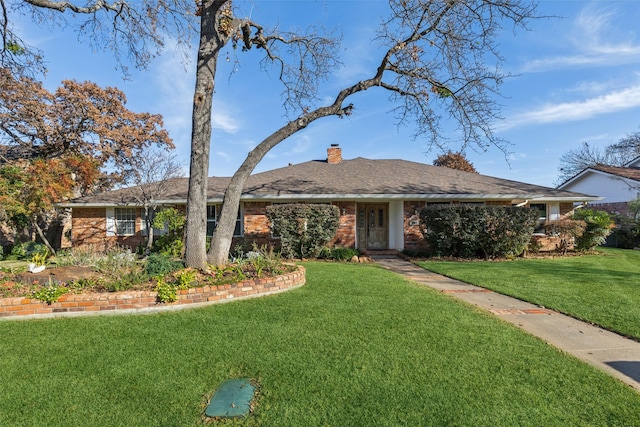 ranch-style home with a front yard