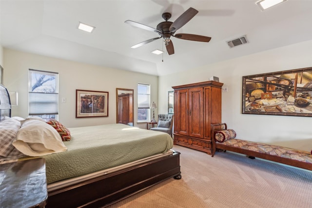 carpeted bedroom with multiple windows and ceiling fan