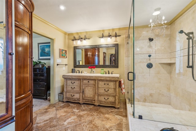 bathroom featuring ornamental molding, an enclosed shower, and vanity