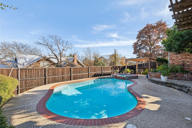 view of swimming pool with an in ground hot tub and a patio area