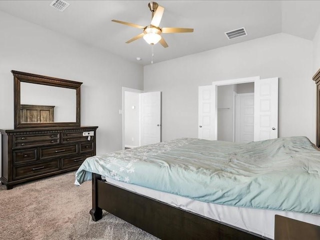 carpeted bedroom featuring ceiling fan and lofted ceiling