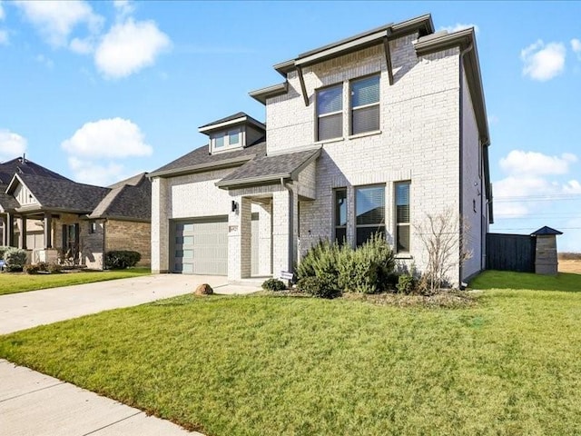 view of front of house featuring a garage and a front yard