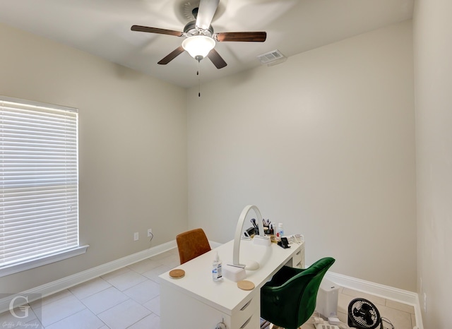 office area featuring visible vents, baseboards, ceiling fan, and light tile patterned flooring