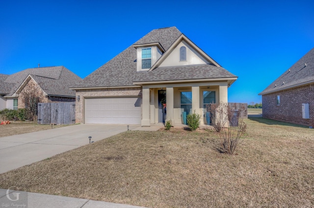 view of front facade with a garage and a front yard