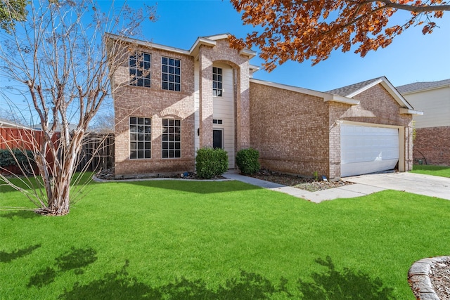 view of front of property featuring a front yard and a garage