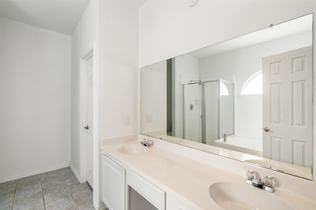 bathroom with tile patterned floors, vanity, and plus walk in shower