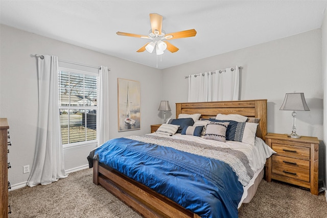 bedroom with ceiling fan and carpet