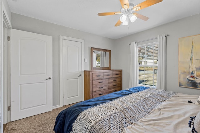 carpeted bedroom with ceiling fan