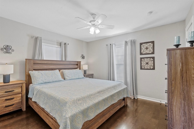 bedroom with dark wood-type flooring and ceiling fan