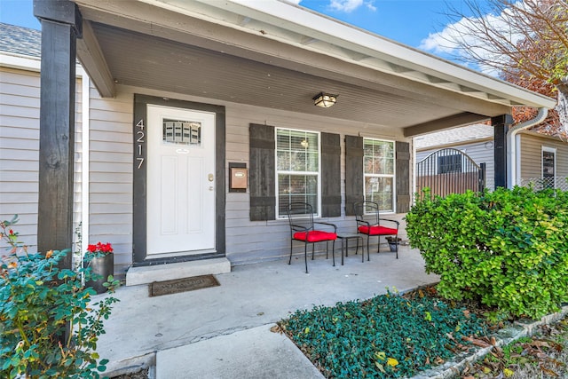 entrance to property featuring a porch