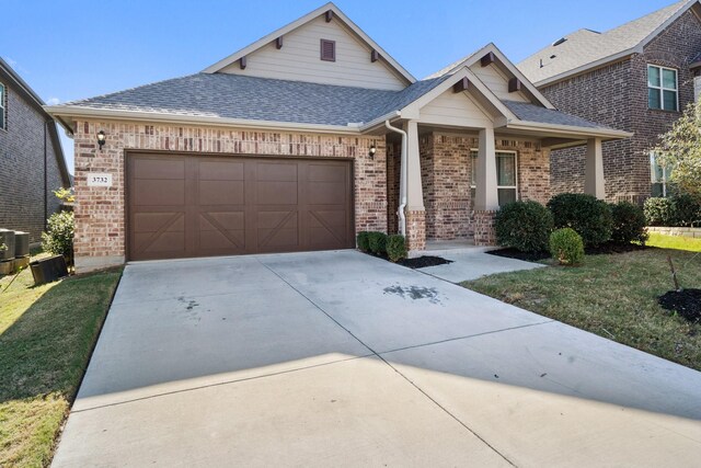 view of front facade featuring a front lawn and a garage