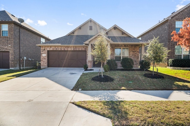 view of front facade featuring a garage and a front lawn